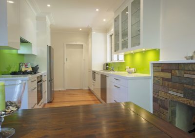 Fire Place-White Cabinets-CaesarStone Tops-Ocean Foam