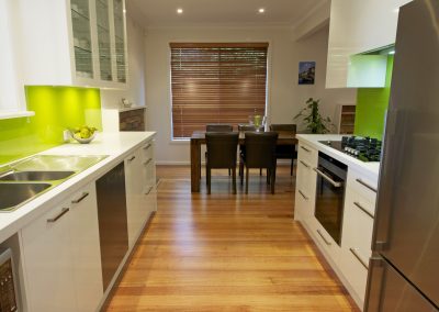 Galley Kitchen-Meals Area-Narrow Room-White Cabinets-White Bench Tops