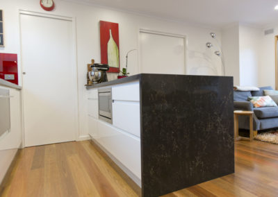 kitchen renovation-waterfall end-built in micro wave-dish drawer-spotted gum-feature floor-polished floor