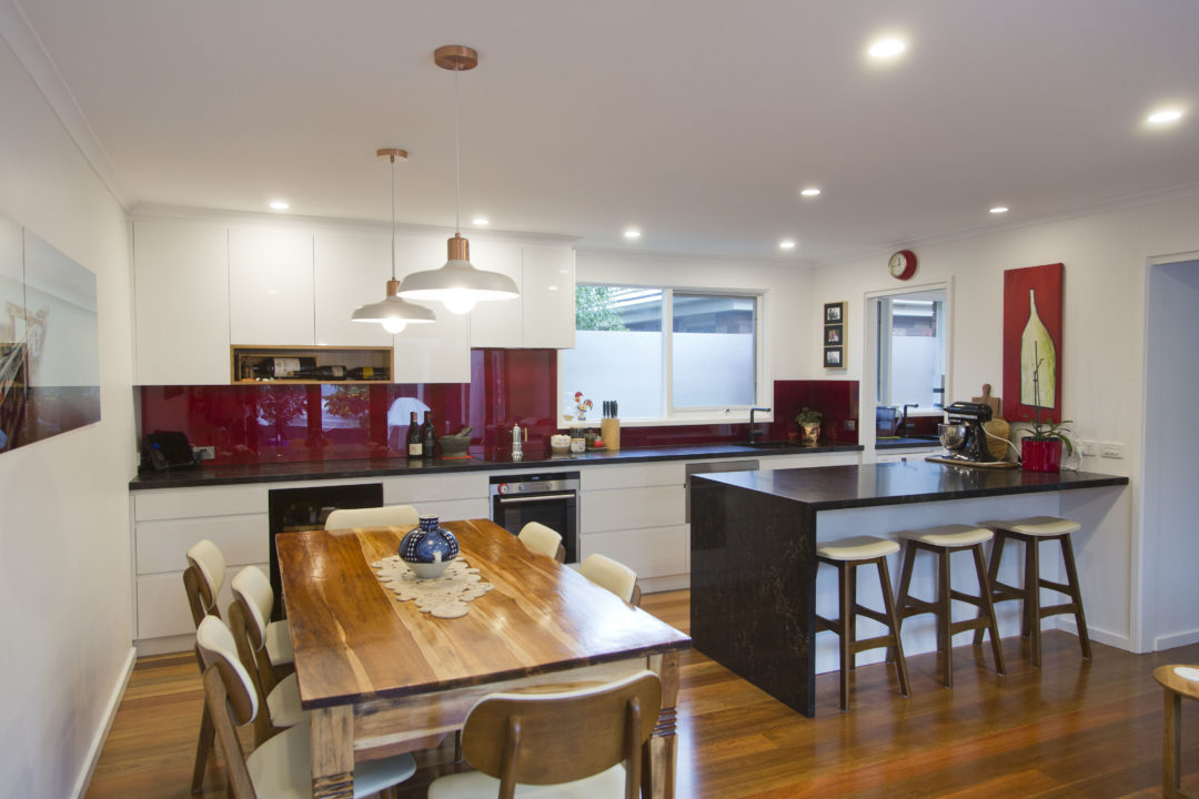 white-gloss-vinyl-spotted gum-polished floors-vanilla noir-kitchen-update-blood pearl-splashback-white pendants